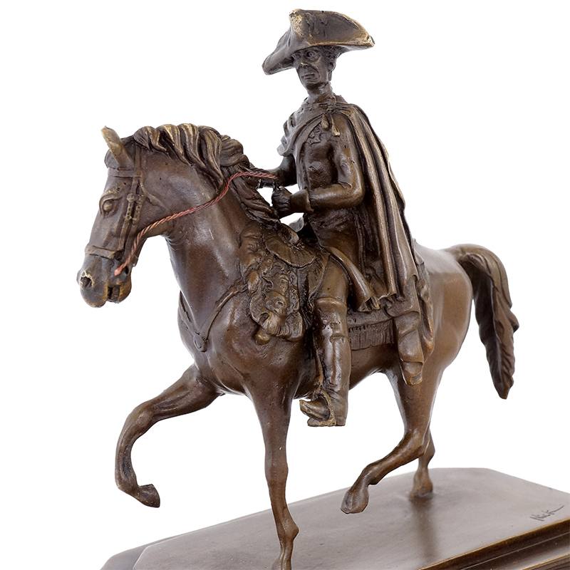Man Riding Horse Statue