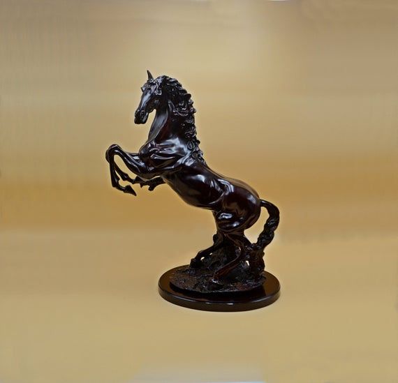 What is the meaning of a horse statue with its legs raised?
