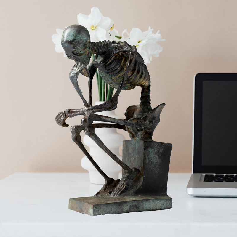contemplating skeleton statue