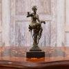 woman and bird sculpture