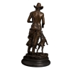 bronze cowboy statue