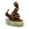 Boy Riding On Snail Statue