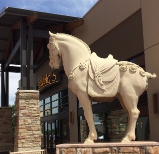 What is the significance of a horse statue outside restaurants, bars, etc.?