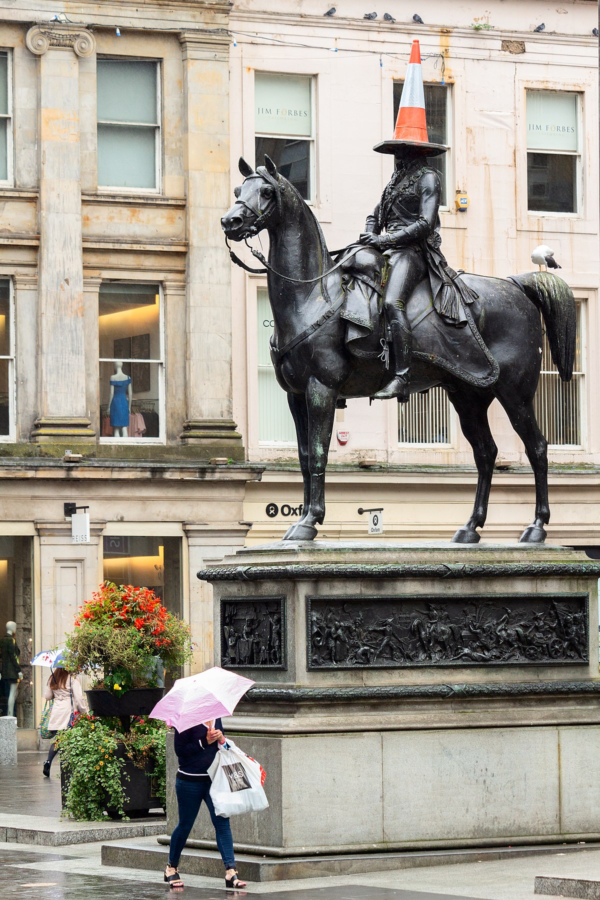 What is the significance of a horse statue outside restaurants, bars, etc.?